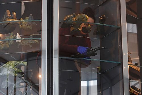 MIKE DEAL / WINNIPEG FREE PRESS
Nicole Fletcher, collections coordinator installing art work in the vault which will open late February 2021, during an announcement Wednesday morning, that a circle of language keepers has given an Inuktitut name to what was formerly known as the Inuit Art Centre: Qaumajuq [HOW-ma-yourq], meaning It is bright, it is lit.
201028 - Wednesday, October 28, 2020.