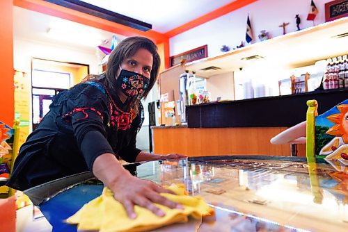 JESSE BOILY  / WINNIPEG FREE PRESS
Mayra Dubon wipes down a table at JC Tacos and More on Thursday. Restaurants such as JC Tacos and More have seen an increase in cost for safety equipment related to COVID-19. Thursday, Oct. 29, 2020.
Reporter:  Temur Durrani