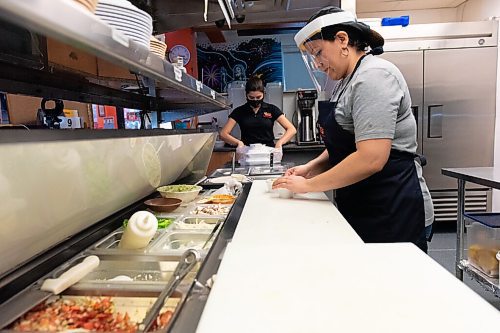 JESSE BOILY  / WINNIPEG FREE PRESS
Angie Lozano, left and Paola Ariza prepare an order for takeout at JC Tacos and More on Thursday. Restaurants such as JC Tacos and More have seen an increase in cost for safety equipment related to COVID-19. Thursday, Oct. 29, 2020.
Reporter:  Temur Durrani