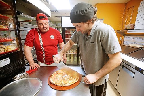 JOHN WOODS / WINNIPEG FREE PRESS
Alfonso Maury, owner of Corrientes pizzeria and La Pampa empanada shop, and his son Ivo make a Las Cuartetas pizza at his pizzeria Thursday, October 29, 2020. 

Reporter: Sanders