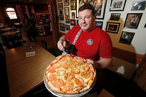 JOHN WOODS / WINNIPEG FREE PRESS
Alfonso Maury, owner of Corrientes pizzeria and La Pampa empanada shop, shows off a Las Cuartetas pizza at his pizzeria Thursday, October 29, 2020. 

Reporter: Sanders