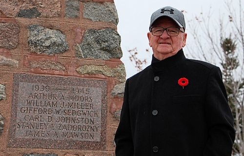 Canstar Community News Roy Switzer, the president of Royal Canadian Legion Branch #171 in Sanford, stands beside the town's war memorial on Oct. 27. Switzer will be one of the few attending the community's Remembrance Day service this year. (GABRIELLE PICHE/CANSTAR COMMUNITY NEWS/HEADLINER)
