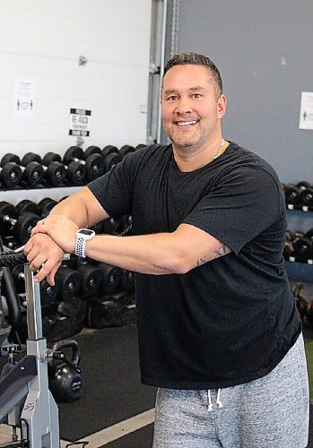 Canstar Community News Sean Brown, the owner of Impact Performance Centre in Oak Bluff, takes a picture in his gym on Oct. 19. Brown has gained some new clients during the pandemic, but he's also lost long-term members. (GABRIELLE PICHE/CANSTAR COMMUNITY NEWS/HEADLINER)