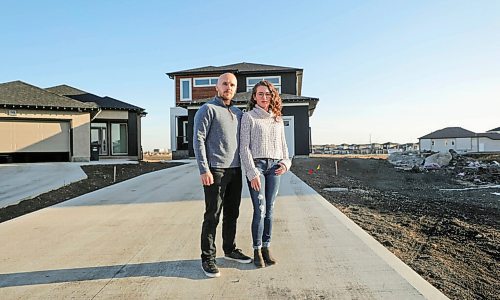 RUTH BONNEVILLE / WINNIPEG FREE PRESS

 local -  impact fees

Keith Mozdzen and his partner Tamsyn Lasuita stand outside next to their newly built home in the Transcona area Wednesday.

More info: Keith Mozdzen, a Winnipeg homeowner who paid an impact fee and said hes still not sure exactly when he will get his money back and is concerned it could still take quite some time to sort things out with developers, not just the city, to see so many different fees returned.

Reporter: JP.

Nov 4th,,  2020