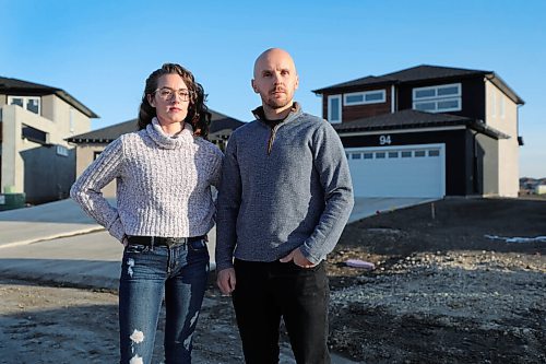 RUTH BONNEVILLE / WINNIPEG FREE PRESS

 local -  impact fees

Keith Mozdzen and his partner Tamsyn Lasuita stand outside next to their newly built home in the Transcona area Wednesday.

More info: Keith Mozdzen, a Winnipeg homeowner who paid an impact fee and said hes still not sure exactly when he will get his money back and is concerned it could still take quite some time to sort things out with developers, not just the city, to see so many different fees returned.

Reporter: JP.

Nov 4th,,  2020
