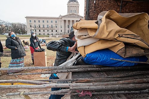 Mike Sudoma / Winnipeg Free Press
Parry Francois, a supporter of the team fast in protest of Bill2, helps pack the remnants of the tipis and supplies into a moving truck Friday afternoon after the bill was passed Friday 
November 6, 2020