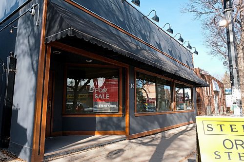 Daniel Crump / Winnipeg Free Press. For sale signs have been put up in the windows of the Stellas restaurant location on Sherbrooke Street. November 7, 2020.