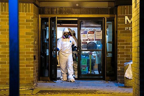 Daniel Crump / Winnipeg Free Press. Members of the Winnipeg Police Identification Unit dressed in protective equipment leave the Maples Personal Care Home. The Winnipeg care home is the site of a COVID-19 outbreak. November 7, 2020.