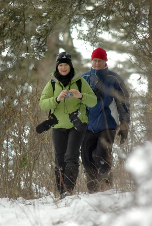 Brandon Sun Parks Canada employees Kate and Cam (SEE MATT FOR LAST NAMES) on the Bead Lakes trail during the Christmas bird count held at Riding Mountain National Park on Tuesday. (Bruce Bumstead/Brandon Sun)