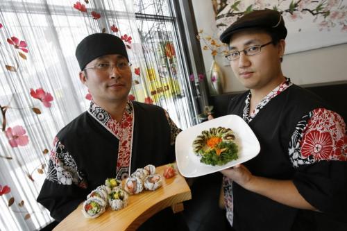 MIKE.DEAL@FREEPRESS.MB.CA 091222 - Tuesday, December 22nd, 2009 (l-r) Rick Park, Owner/Chef of Wako Sushi Cafe and Will Kim, Chef with the Veggie Garden Roll, Special Roll and the Green Dragon Roll. MIKE DEAL / WINNIPEG FREE PRESS