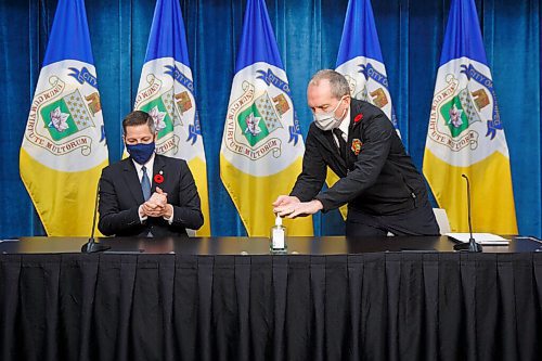 MIKE DEAL / WINNIPEG FREE PRESS
Mayor Brian Bowman and Winnipeg Fire Paramedic Service Chief John Lane speak during a media conference at City Hall Monday morning regarding the City's involvement in Personal Care Home response, specifically at the Maples Personal Care Home. 
201109 - Monday, November 09, 2020.