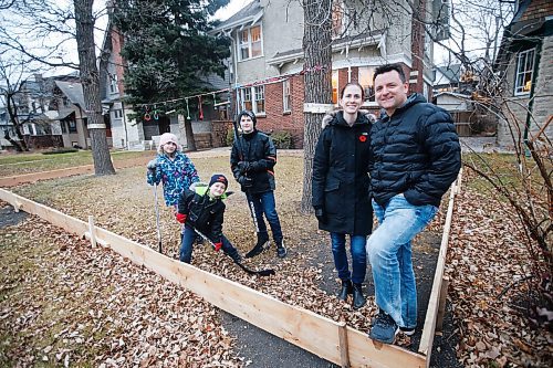 JOHN WOODS / WINNIPEG FREE PRESS
Shane and Kara McCartney with their children, left to right, Emerson, Blake, and Aiden are photographed with their home rink Monday, November 9, 2020. Many families plan on building their own rinks to get through the winter and COVID-19 restrictions.

Reporter: Ben