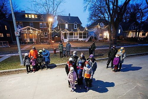 JOHN WOODS / WINNIPEG FREE PRESS
Doug Hemmerling and his family, centre, and their neighbour families from left Epp, Rosenblat, Foo and Funke-Minkevich are photographed with their 3 yard home rink Monday, November 9, 2020. Many families plan on building their own rinks to get through the winter and COVID-19 restrictions.

Reporter: Ben