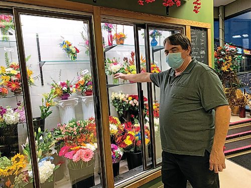 Canstar Community News Jonathon Halldorson shows off his floral wares at Lakewood Florist & Gifts. He reports that his business, which he co-owns with Rona-Leigh Rempel, has fared well this year, despite the COVID-19 pandemic.