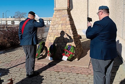 JESSE BOILY  / WINNIPEG FREE PRESS
Marc Pelletier shows viewers of the live-streamed Remembrance Day ceremony the wreaths while Alex Vacca stands at a salute at the  South Osborne Legion on Wednesday. Remembrance Day ceremonies looked different this year due to the current COVID-19 restrictions. Wednesday, Nov. 11, 2020.
Reporter:
