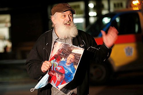 JOHN WOODS / WINNIPEG FREE PRESS
Larry Baillie holds a photo of his father Glenn as he speaks to family members gathered outside Maples Personal Care Home for a vigil for residents in Winnipeg Wednesday, November 11, 2020. COVID-19 has killed many residents of the care home.

Reporter: Jay