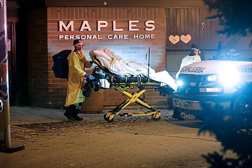 JOHN WOODS / WINNIPEG FREE PRESS
A resident is removed by paramedics as family members gather outside Maples Personal Care Home for a vigil for residents in Winnipeg Wednesday, November 11, 2020. COVID-19 has killed many residents of the care home.

Reporter: Jay