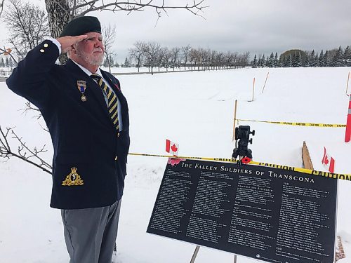 Canstar Community News Peter Martin salutes the fallen soldiers of Transcona whose names are recorded on a commemrative plaque at the Field of Honour in Transcona Cemetery.