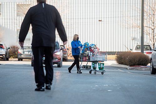 Mike Sudoma / Winnipeg Free Press
A shopper makes their way through the parking lot after stocking up at Costco during the code red lockdown in Winnipeg Monday afternoon
November 16, 2020