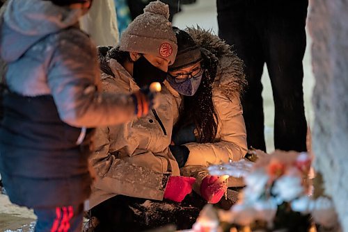 JESSE BOILY  / WINNIPEG FREE PRESS
The mother of Wade Donkey, sits next to her sons vigil at the corner of Elgin Ave and Isabel St on Thursday. Donkey was shot at the street corner on Nov. 17, 2020. Notes were attached to a nearby wall sharing memories and well wishes to the deceased.  Thursday, Nov. 19, 2020. NOTE: I had an organizer give me the mothers name as Lisa Moore but she said she wasnt sure if that was correct spelling. 
Reporter: