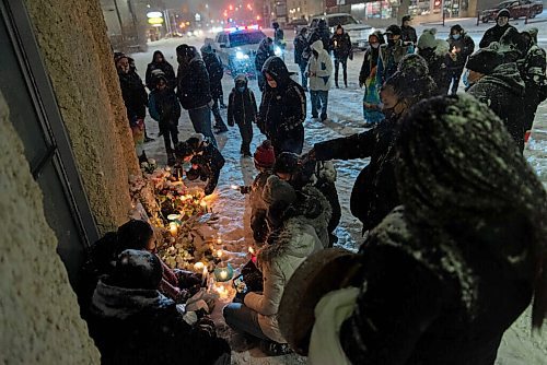 JESSE BOILY  / WINNIPEG FREE PRESS
The mother of Wade Donkey, sits next to her sons vigil at the corner of Elgin Ave and Isabel St on Thursday. Donkey was shot at the street corner on Nov. 17, 2020. Notes were attached to a nearby wall sharing memories and well wishes to the deceased.  Thursday, Nov. 19, 2020. NOTE: I had an organizer give me the mothers name as Lisa Moore but she said she wasnt sure if that was correct spelling. 
Reporter: