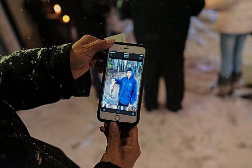JESSE BOILY  / WINNIPEG FREE PRESS
Vivian Ketchum shows a photos of Wade Donkey at his vigil at the corner of Elgin Ave and Isabel St on Thursday. Donkey was shot at the street corner on Nov. 17, 2020. Notes were attached to a nearby wall with memories and well wishes to the deceased.  Thursday, Nov. 19, 2020. NOTE: I had an organizer give me the mothers name as Lisa Moore but she said she wasnt sure if that was correct spelling. 
Reporter: