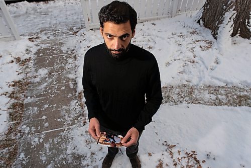 JESSE BOILY  / WINNIPEG FREE PRESS
Fadi Ennab, who sends money to his elderly father every month, stops for a photo while holding a photos of his father, outside his home on Friday. Friday, Nov. 20, 2020.
Reporter: Malak Abas
