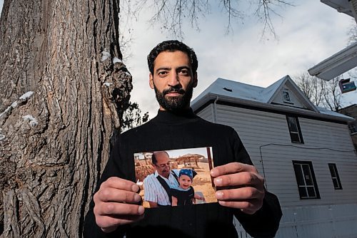 JESSE BOILY  / WINNIPEG FREE PRESS
Fadi Ennab, who sends money to his elderly father every month, stops for a photo while holding a photos of his father, outside his home on Friday. Friday, Nov. 20, 2020.
Reporter: Malak Abas