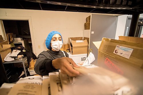 Mike Sudoma / Winnipeg Free Press
Farzana Esmail sorts through local Winnipeg products to fulfill an order through new local business network, Good Local Friday morning.
November 20, 2020