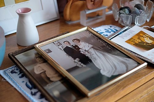 Daniel Crump / Winnipeg Free Press. Pictures of Lilian Bonins mother are spread across a mantel in Lillians home. Christine Bonin died, age 89, at Victoria General Hospital, because of medical complications related to COVID-19. November 21, 2020.