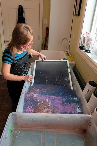 JESSE BOILY  / WINNIPEG FREE PRESS
Milli Flaig-Hooper, an artist who makes their own paper creating mixed media pieces, dips a screen into her paper pulp slurry in their home studio in Matlock on Sunday. Sunday, Nov. 22, 2020.
Reporter: Dave