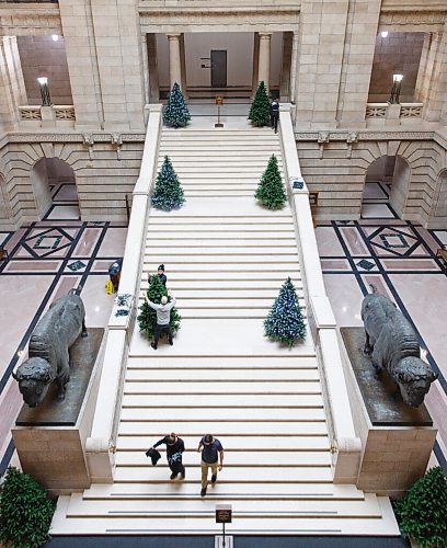 MIKE DEAL / WINNIPEG FREE PRESS
Manitoba Legislative building maintenance staff put lights onto the trees on the grand staircase Tuesday afternoon.
201124 - Tuesday, November 24, 2020.