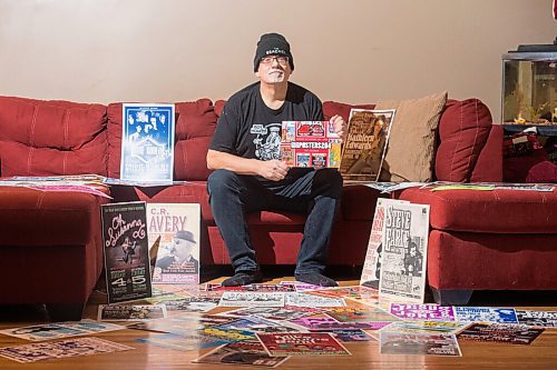 Mike Sudoma / Winnipeg Free Press
Stu Reid aka Stu Art holds up his newly released Gig Posters calendar, while being surrounded by just a few of the posters hes designed over the years.
November 24, 2020