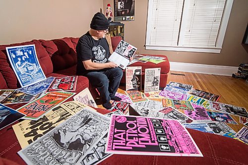 Mike Sudoma / Winnipeg Free Press
Stu Reid aka Stu Art looks through his newly released Gig Posters calendar, while being surrounded by just a few of the posters hes designed over the years.
November 24, 2020