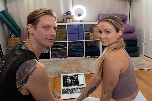 JESSE BOILY  / WINNIPEG FREE PRESS
Noah Krol and Marisa Cline, owners of Peg City Yoga, pose for a photo in their home studio where they now stream their yoga lessons online, on Thursday. Thursday, Nov. 26, 2020.
Reporter: Eva Wasney