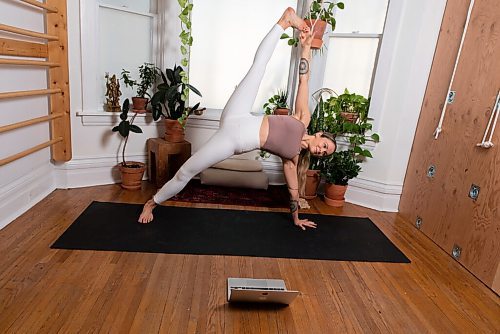 JESSE BOILY  / WINNIPEG FREE PRESS
Marisa Cline, owner of Peg City Yoga, poses for a photo in their home studio where they now stream their yoga lessons online, on Thursday. Thursday, Nov. 26, 2020.
Reporter: Eva Wasney