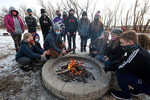 JOHN WOODS / WINNIPEG FREE PRESS
Tim Morison, a phys. ed. teacher at Starbuck School in Starbuck is photographed shows how to build a survival fire as students look on Thursday, November 26, 2020. Morison has moved his class outside and created some interesting programming which includes winter survival and shovelling snow for local seniors.

Reporter: McIntosh