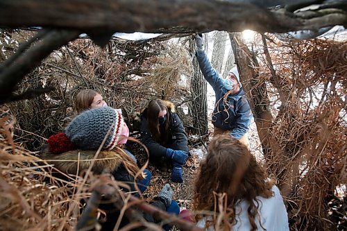 JOHN WOODS / WINNIPEG FREE PRESS
Tim Morison, a phys. ed. teacher at Starbuck School in Starbuck is photographed with students, from left, Anjali Smelski Zuk, Myriam Duval, Isabel Fischer and Kiera Mosset as they work on their survival shelter Thursday, November 26, 2020. Morison has moved his class outside and created some interesting programming which includes winter survival and shovelling snow for local seniors.

Reporter: McIntosh