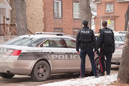 Mike Sudoma / Winnipeg Free Press
Two Winnipeg Police officers stand by after taking a person out of the Stratford apartments Friday afternoon after a homicide took place in the building around 4am Friday morning.
November 27, 2020