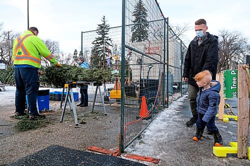 Daniel Crump / Winnipeg Free Press. Nathan Zahn and son Nova wait to pick-up their Christmas tree at the 67th Scout Group tree lot in River Heights. Because of pandemic restrictions Christmas trees have to be preordered and are only available for curtsied pickup. November 28, 2020.