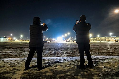 Daniel Crump / Winnipeg Free Press. Enforcement officers record the drive-in service at Springs Church from the edge of the churches property. Its not currently known if any fines were issued on site. November 28, 2020.