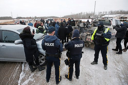 JOHN WOODS / WINNIPEG FREE PRESS
A tow truck is moved in to remove a van as RCMP officers and Manitoba Justice officials blocked the entrance to Church of God Restoration in Sarto, just south of Steinbach, to enforce Manitoba Health COVID-19 orders Sunday, November 29, 2020. 

Reporter: Abas
