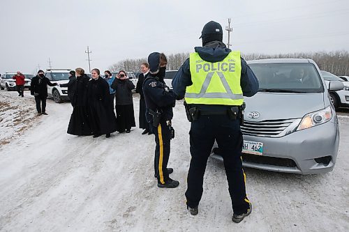 JOHN WOODS / WINNIPEG FREE PRESS
Parishioners look on as RCMP officers and Manitoba  Justice officials blocked the entrance to Church of God Restoration in Sarto, just south of Steinbach, to enforce Manitoba Health COVID-19 orders Sunday, November 29, 2020. 

Reporter: Abas