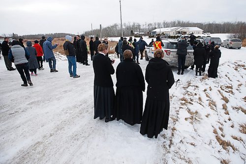 JOHN WOODS / WINNIPEG FREE PRESS
Parishioners look on as their pastor speaks from a truck  and RCMP officers and Manitoba Justice officials blocked the entrance to Church of God Restoration in Sarto, just south of Steinbach, to enforce Manitoba Health COVID-19 orders Sunday, November 29, 2020. 

Reporter: Abas