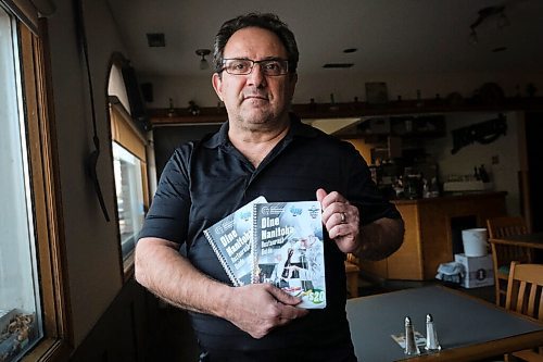 Daniel Crump / Winnipeg Free Press. Joe Loschiavo, owner Pasquale's Ristorante, with a mock-up of an Entertainment type coupon book that is being released next week, to help restaurateurs through the Code Red shutdown. November 30, 2020.