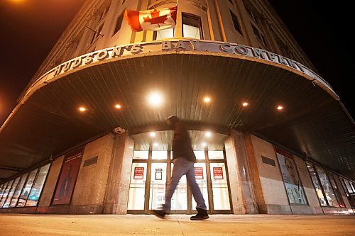 JOHN WOODS / WINNIPEG FREE PRESS
A person walks past the downtown Hudson Bay building Monday, November 30, 2020. Local media reported that The Bay brought its closing date forward from February and closed the store today.

Reporter: Standup