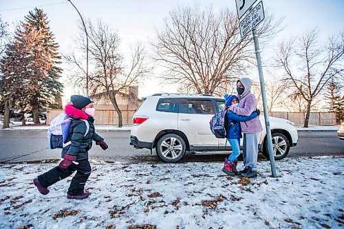 MIKAELA MACKENZIE / WINNIPEG FREE PRESS

Yodit Newet  picks up her daughters, Amran Eschetu (6, left) and Redeat Eschetu (10), at Sun Valley School in Winnipeg on Wednesday, Dec. 2, 2020. For Maggie/Kellen story.

Winnipeg Free Press 2020