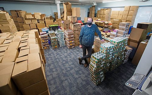 MIKE DEAL / WINNIPEG FREE PRESS
Jeff Liba, CEO of Variety, the Childrens Charity of Manitoba, surrounded by Christmas hampers for needy families at their offices.
201203 - Thursday, December 03, 2020.