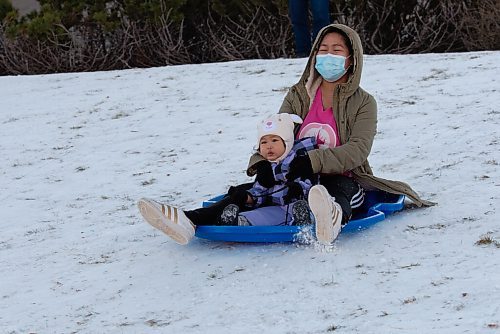 JESSE BOILY  / WINNIPEG FREE PRESS
Jhulee Malayba and her daughter Erich, 2, enjoy the warm weather by tobogganing at the Forks on Sunday. Sunday, Dec. 6, 2020.
Reporter: Standups