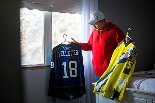 MIKAELA MACKENZIE / WINNIPEG FREE PRESS

Lloyd Pelletier poses for a portrait with a Broncos jersey and a jersey from his time playing in Europe at his home in Lockport on Friday, Dec. 4, 2020. For Jeff Hamilton story.

Winnipeg Free Press 2020